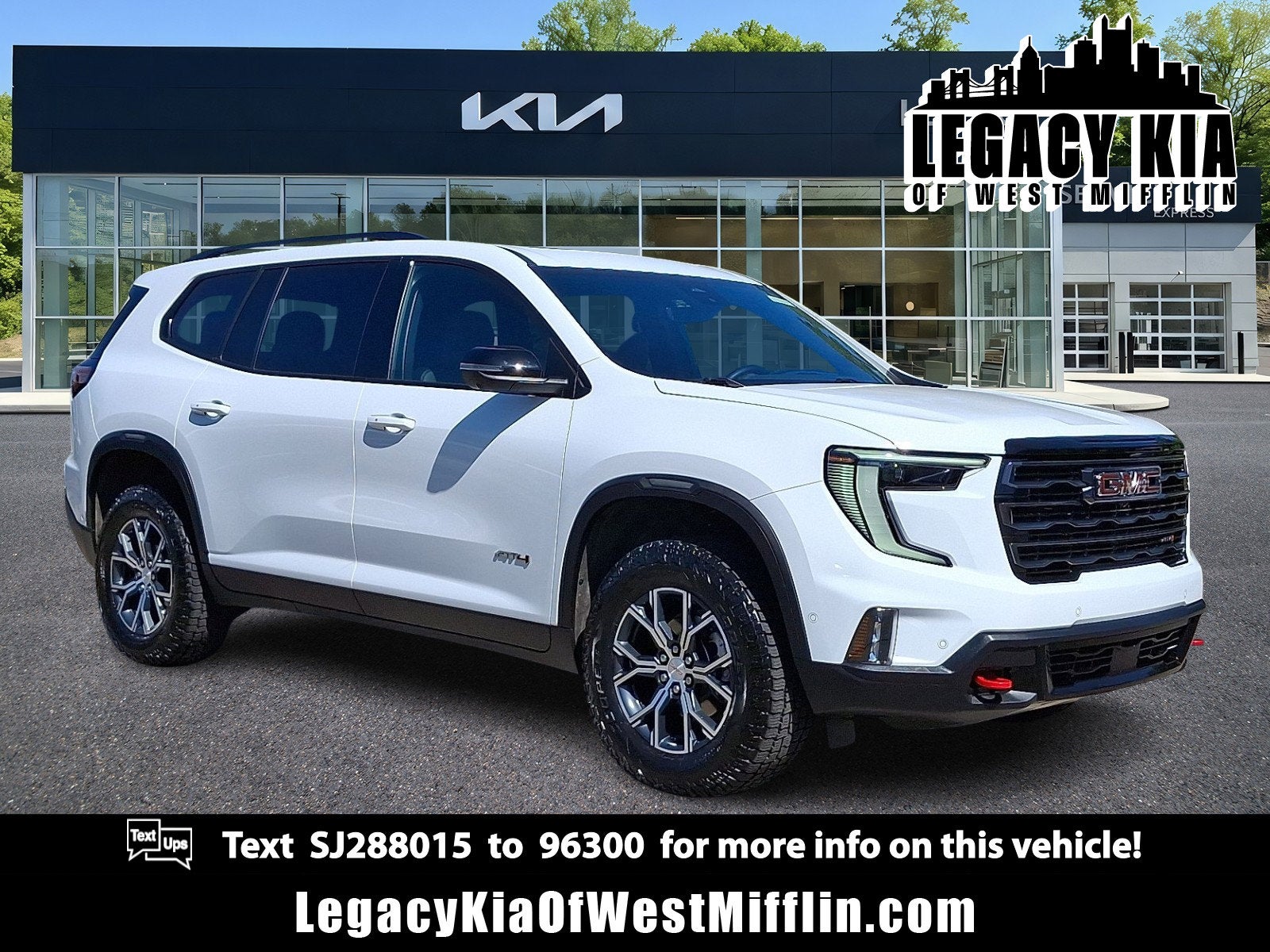 2025 GMC Acadia AWD AT4 in Summit White — front three-quarter view